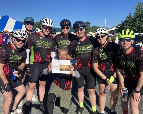 Troy Whitney with a cycling team